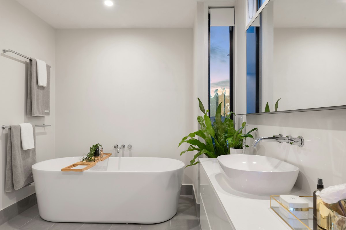 Bright renovated bathroom with a modern bathtub and vanity in a Hyderabad home